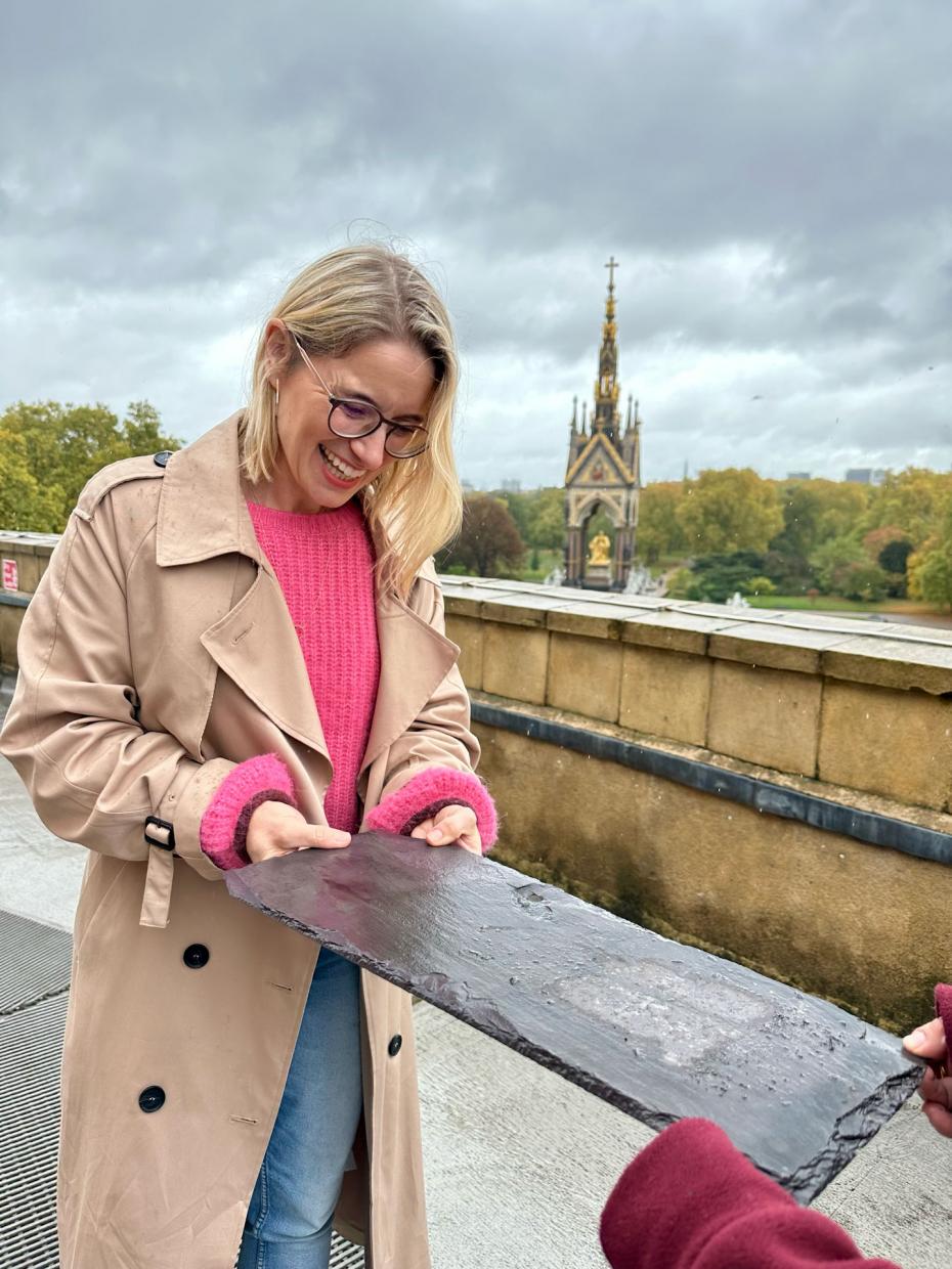 Victoria Eggs inspecting the slates on the roof of the Royal Albert Hall with buyer Flo Barillo