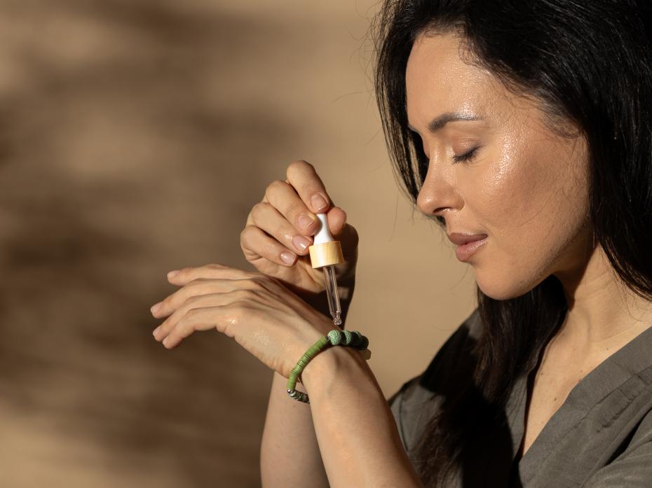 Applying Essential Oil onto the Lava porous beads to allow for the scent to diffuse