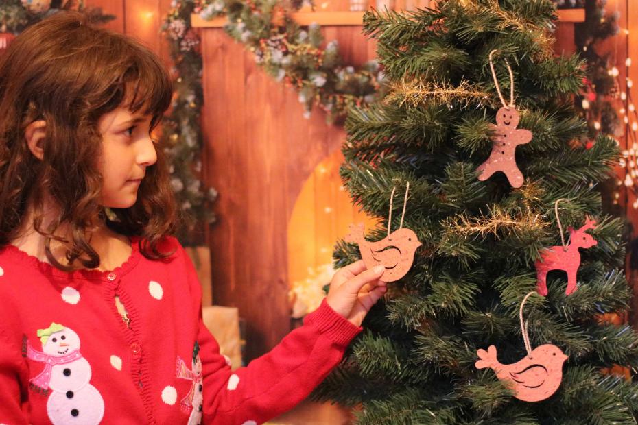 Hanging the decorations on the tree