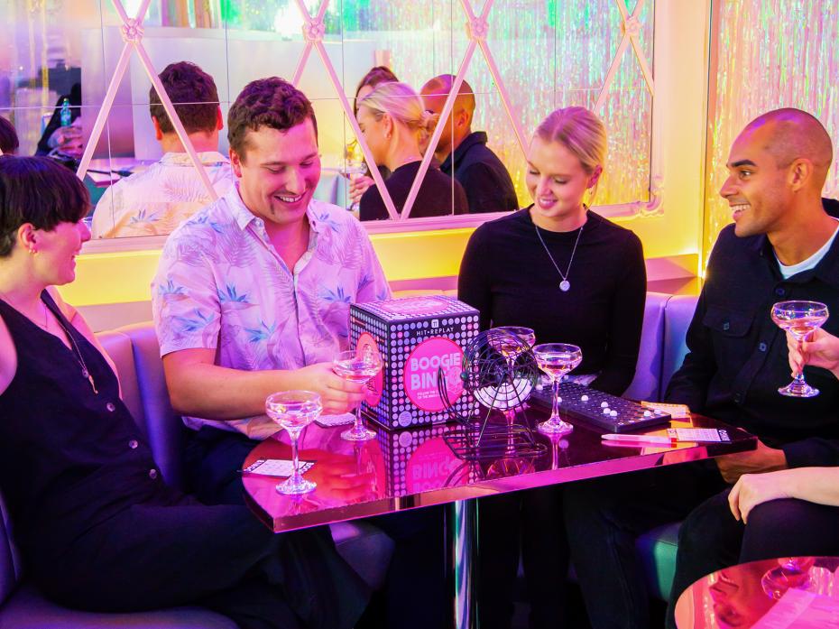 Blast your favourite tunes and bring the fun of the bingo hall to your very own home with this Music Bingo Game by Talking Tables