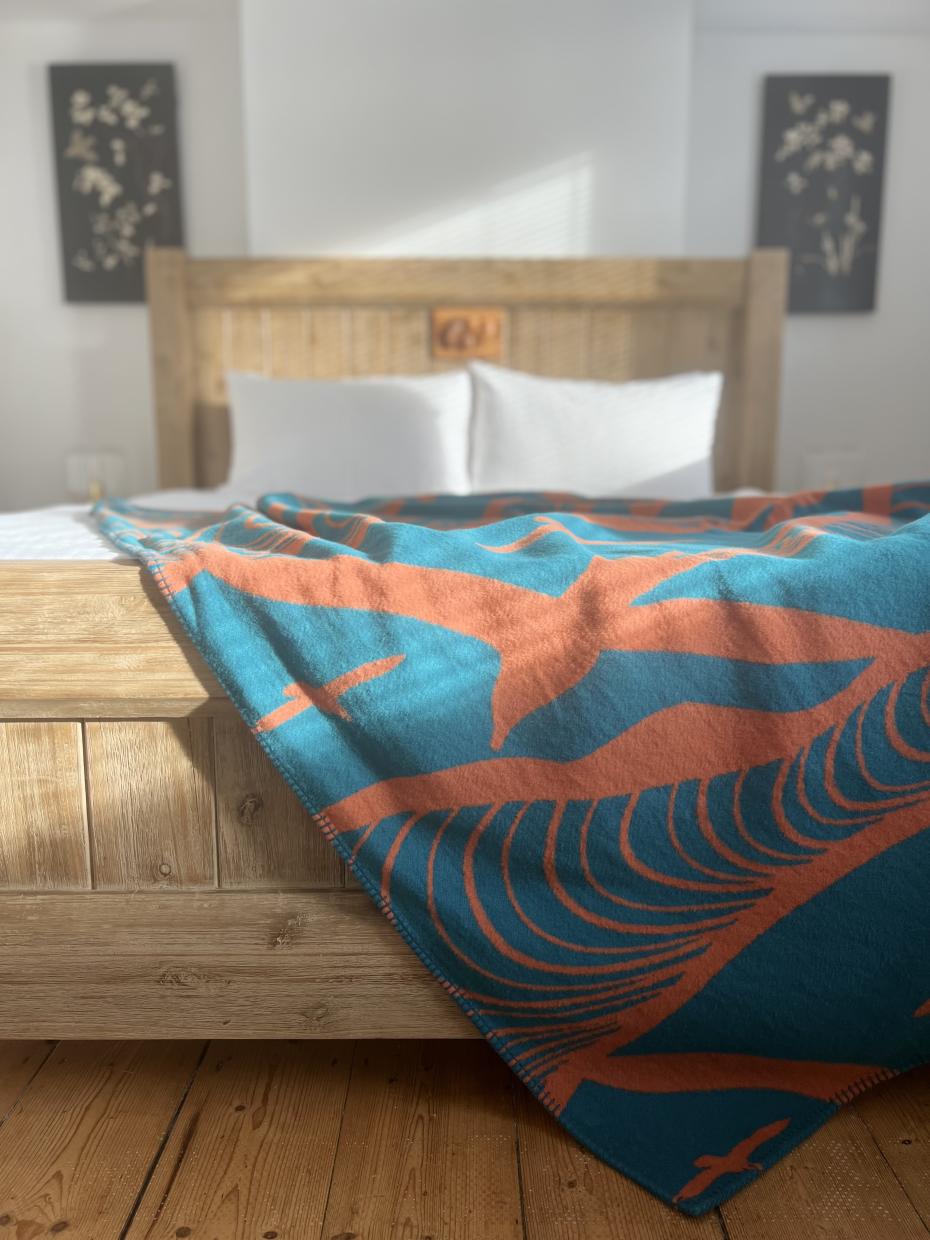 Gliding as a throw for the bed, with gorgeous winter light